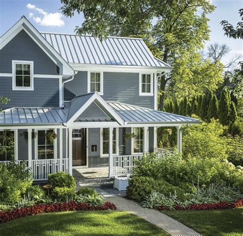 brick house with silver metal roof|matching brick and roof colors.